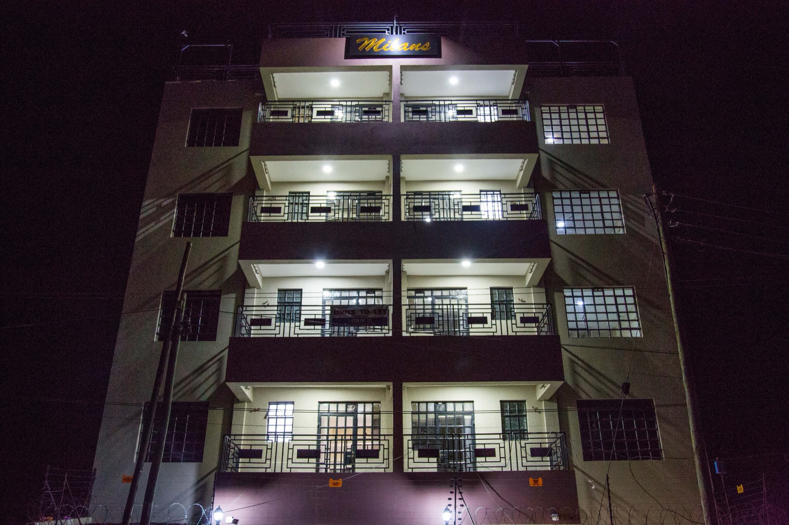 Completed Milans by KCiti building illuminated at night in Nanyuki