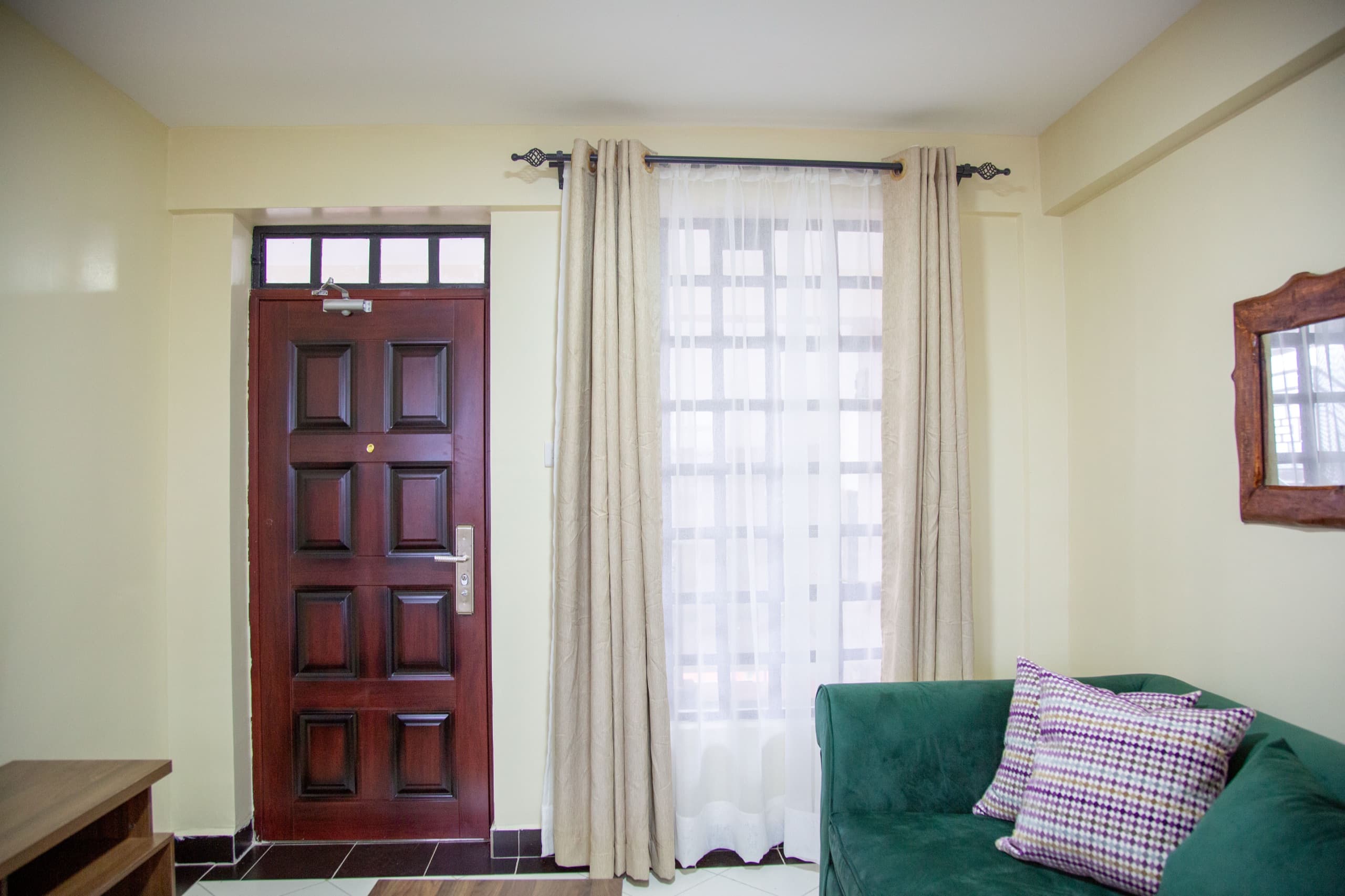 Furnished entryway and living space in a Milans by KCiti home
