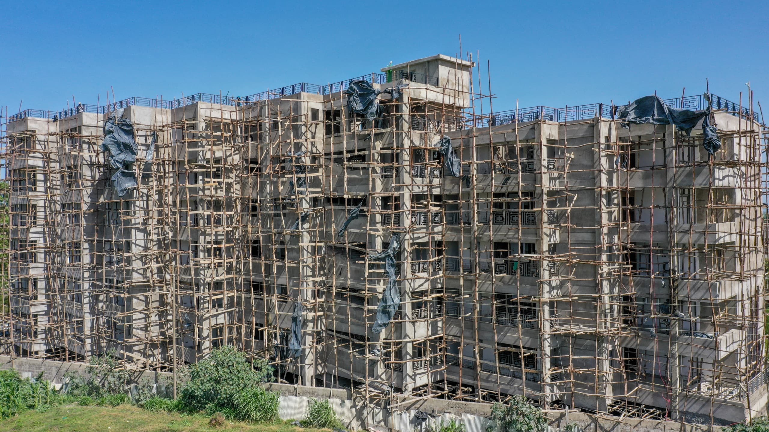 Naples by KCiti structure rising under scaffolding, February 2026